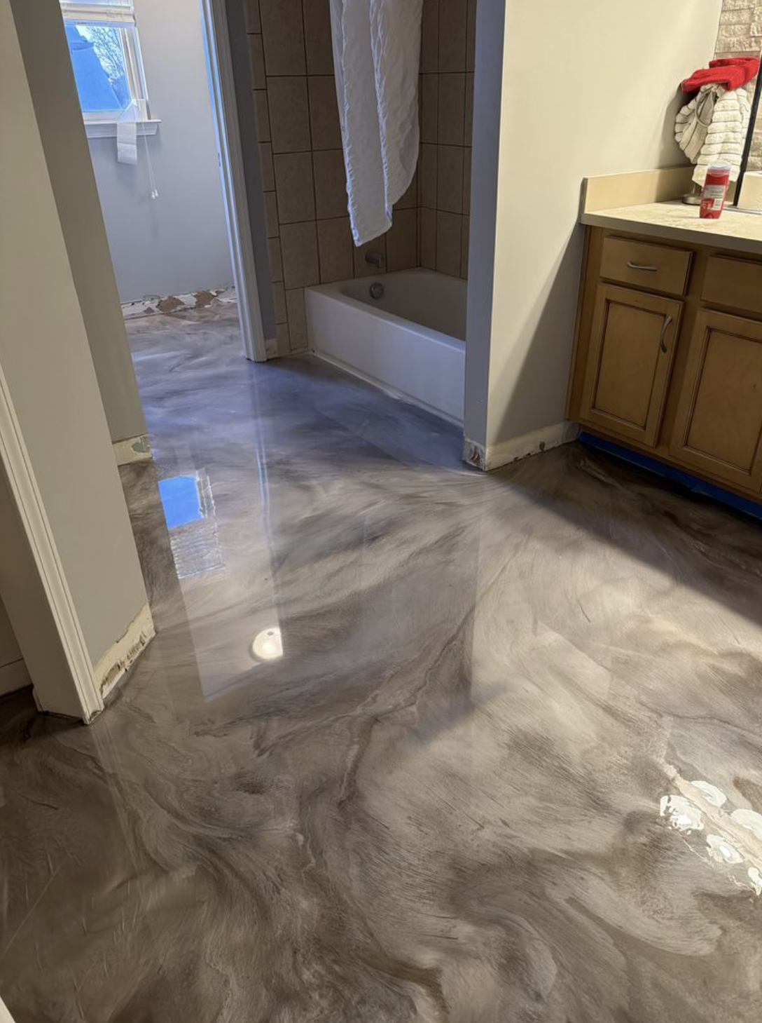 Glossy metallic epoxy bathroom floor